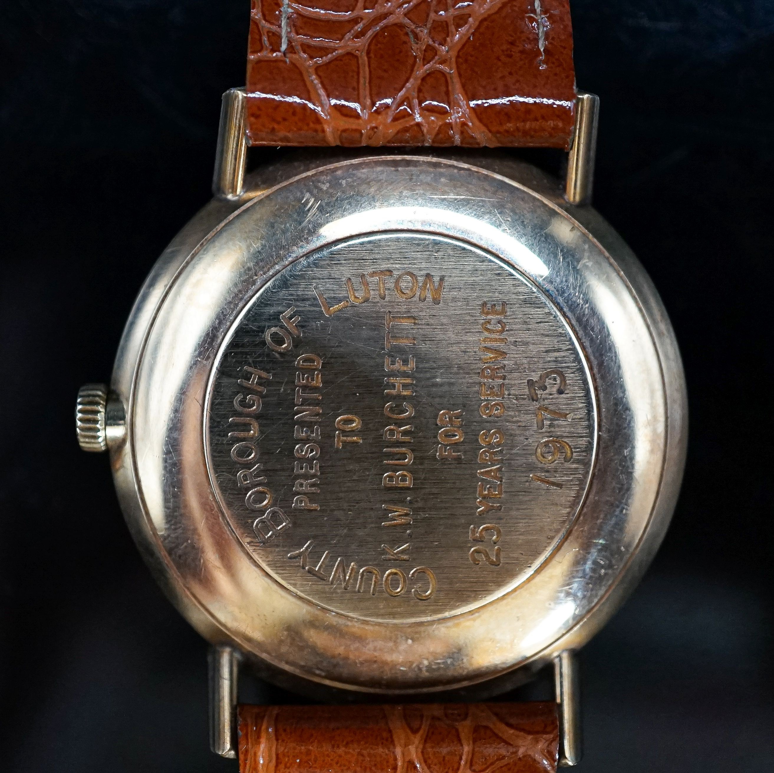 A gentleman's yellow metal Omega manual wind wrist watch, on associated leather strap, with engraved inscription, case diameter 33mm